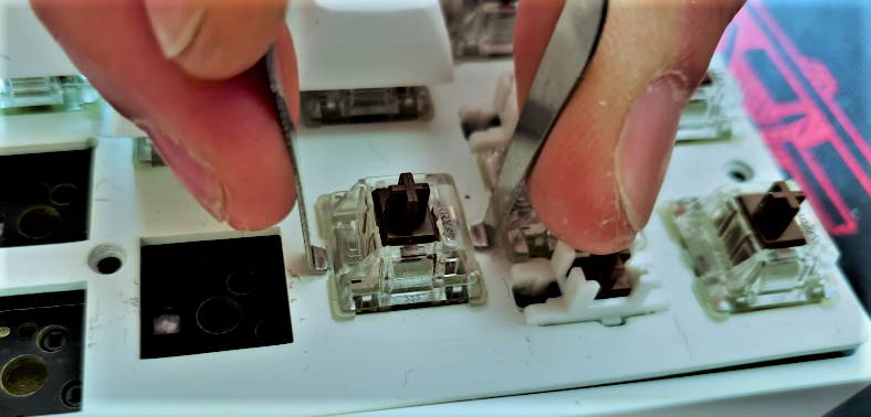 Remove Switches from Keyboard by Using a Keycap Puller 